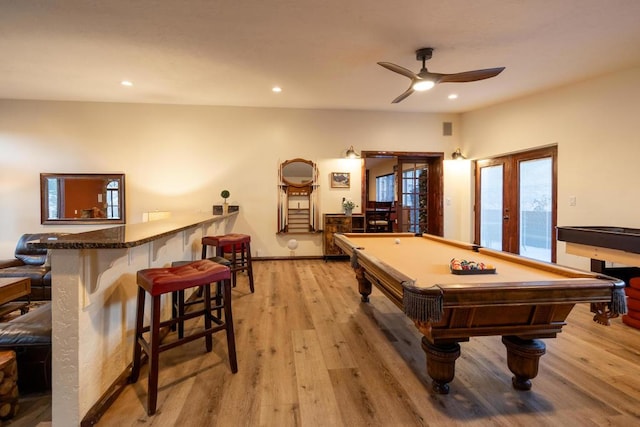 recreation room featuring french doors, billiards, ceiling fan, bar area, and light hardwood / wood-style flooring