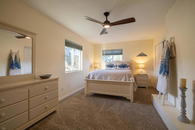 bedroom with ceiling fan and dark carpet