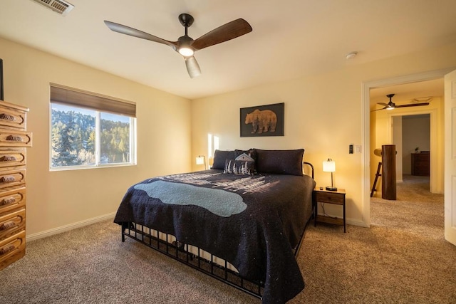 bedroom with ceiling fan and carpet