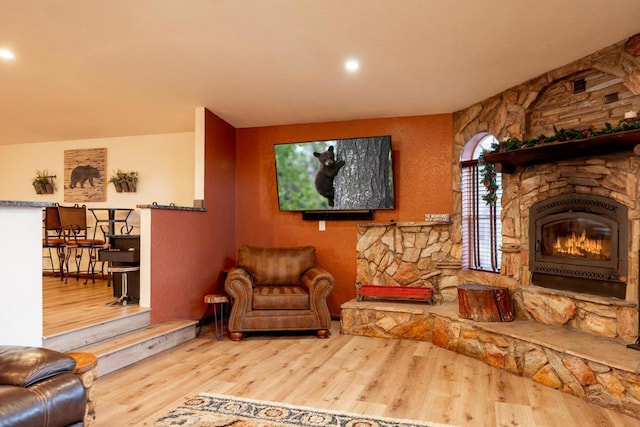 sitting room featuring a fireplace and hardwood / wood-style floors