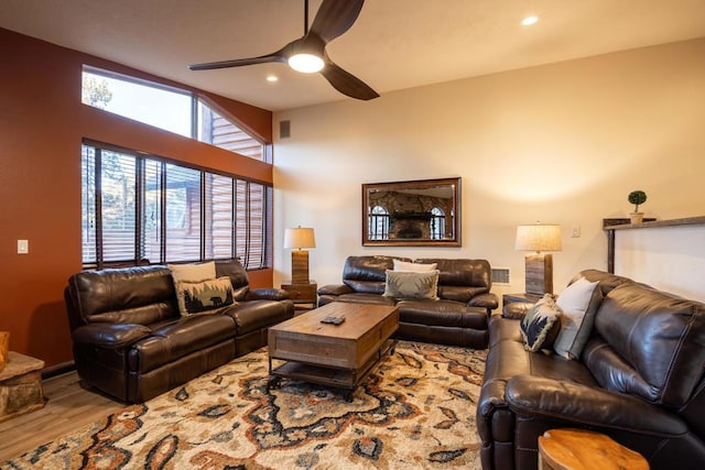 living room featuring ceiling fan and hardwood / wood-style floors