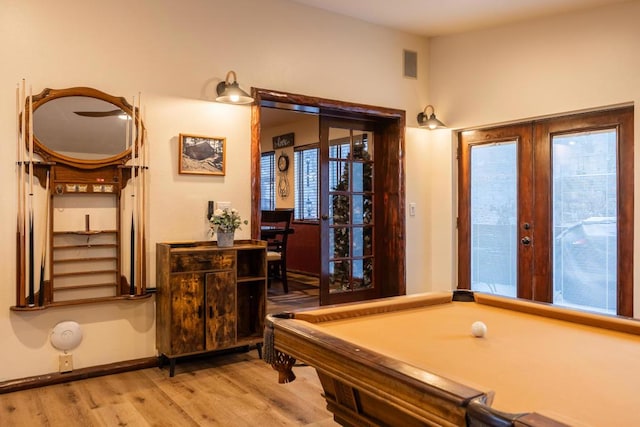 playroom featuring light hardwood / wood-style floors, pool table, and french doors