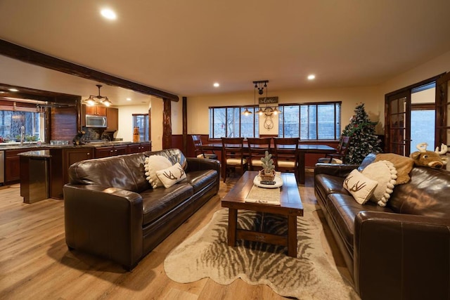 living room with light hardwood / wood-style flooring