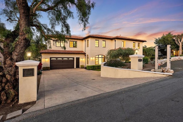 mediterranean / spanish-style house featuring a garage