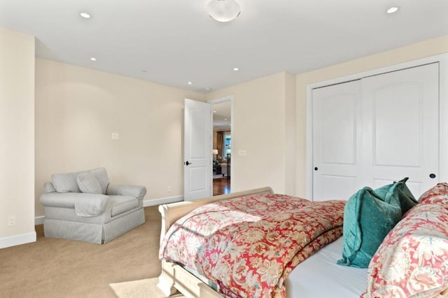 carpeted bedroom with a closet