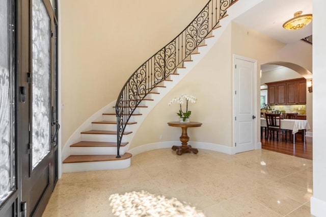 foyer featuring a high ceiling