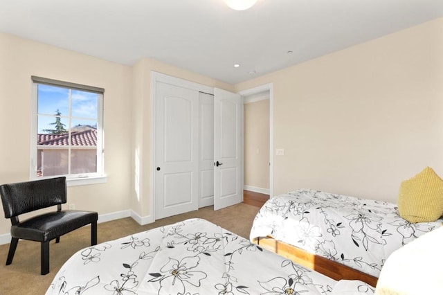 carpeted bedroom with a closet