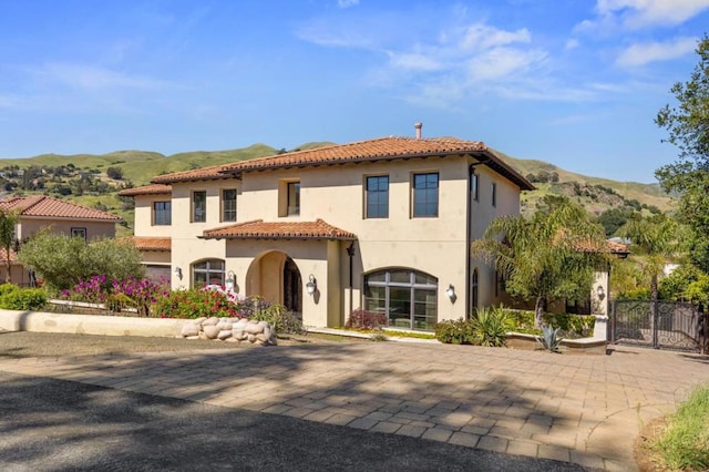 mediterranean / spanish-style home featuring a mountain view