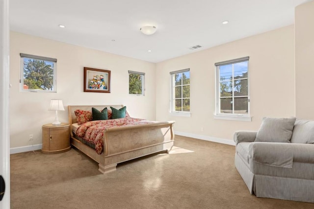 bedroom featuring light colored carpet