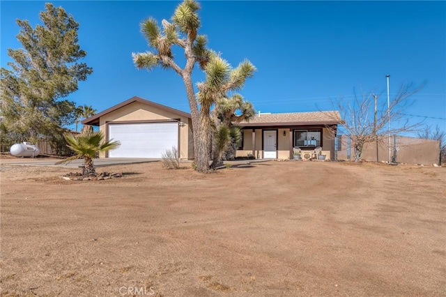 ranch-style home featuring a garage