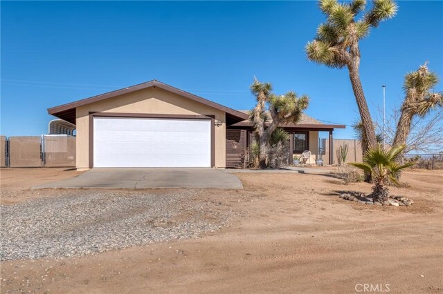 single story home featuring a garage