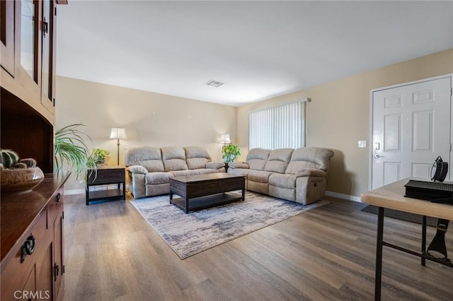 living room with dark hardwood / wood-style floors