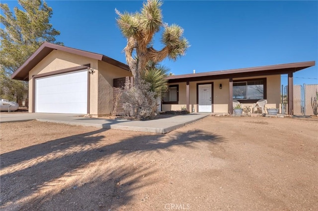 single story home featuring a garage