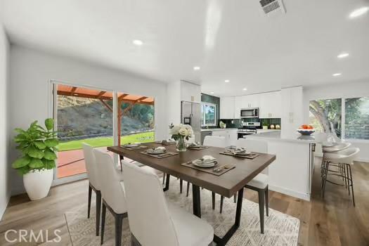 dining room with light hardwood / wood-style floors