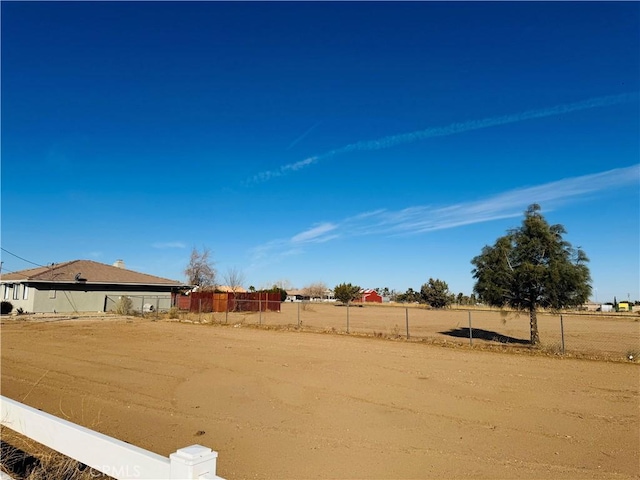 view of yard with a rural view