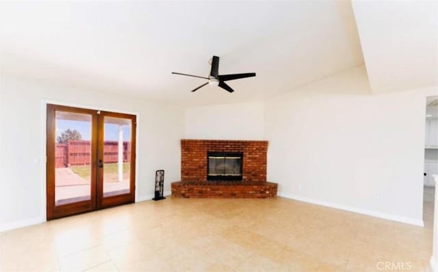 unfurnished living room with french doors, ceiling fan, and a fireplace