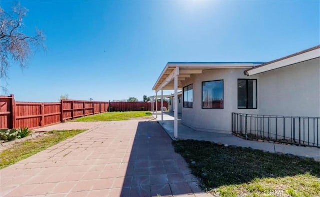 view of property exterior featuring a patio area