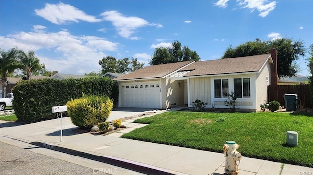 single story home with a front lawn and a garage