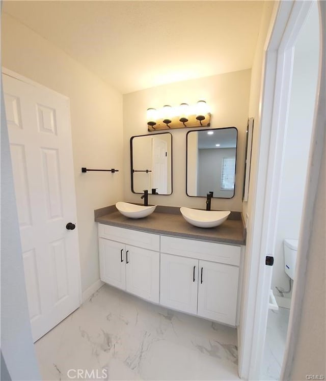 bathroom with toilet and vanity