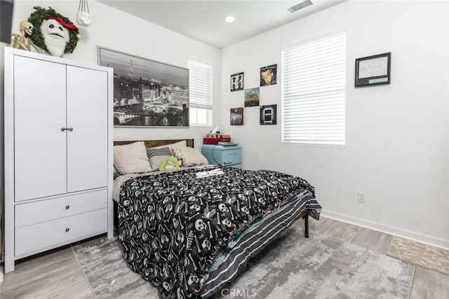 bedroom with hardwood / wood-style floors