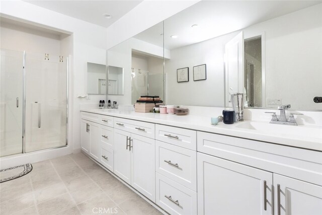 bathroom with an enclosed shower and vanity