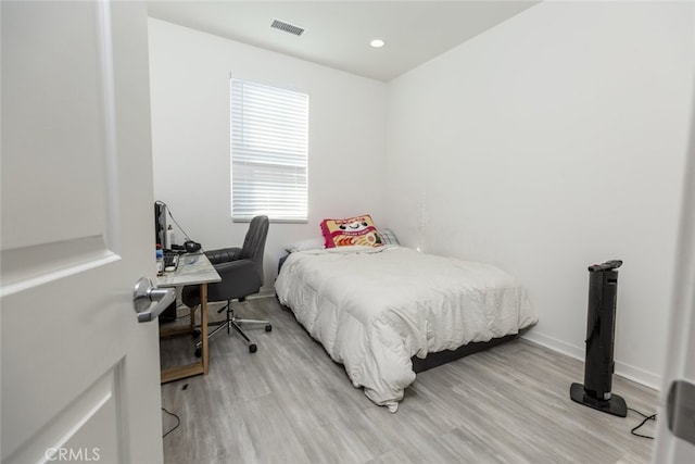 bedroom featuring light hardwood / wood-style floors