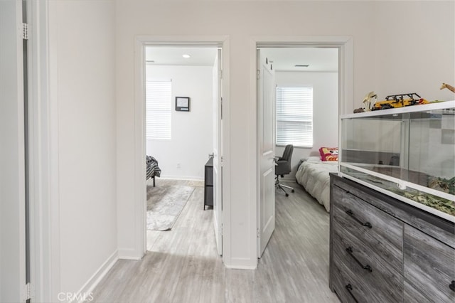 hallway featuring light wood-type flooring