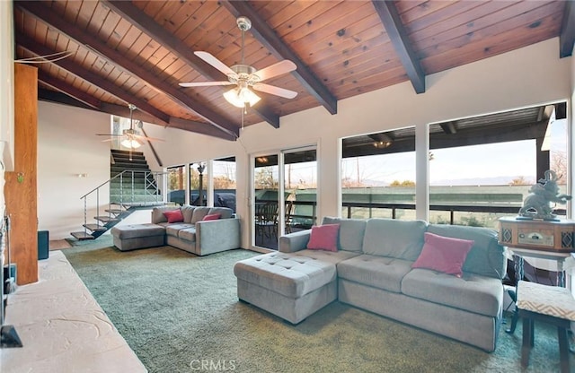 sunroom / solarium with ceiling fan, lofted ceiling with beams, and wooden ceiling