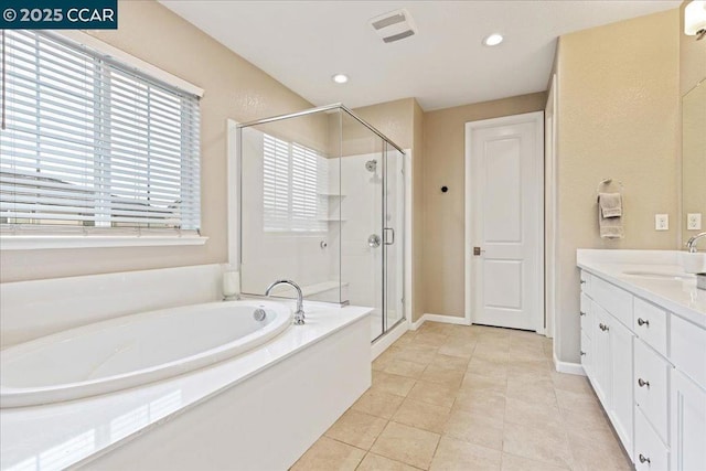 bathroom featuring vanity, tile patterned flooring, and independent shower and bath