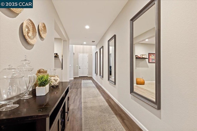 hallway with dark wood-type flooring