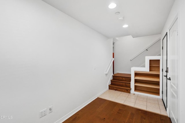 staircase with tile patterned floors