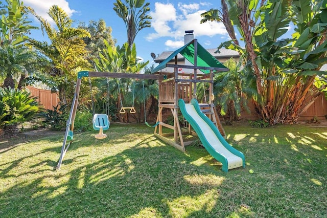 view of jungle gym with a lawn