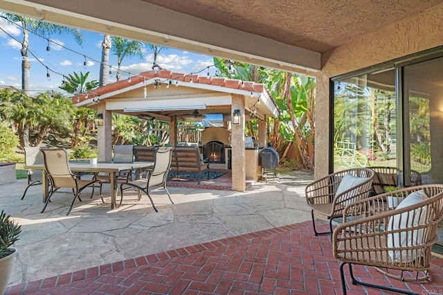 view of patio featuring an outdoor fireplace