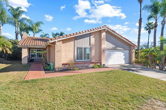 view of front of property featuring a garage and a front lawn