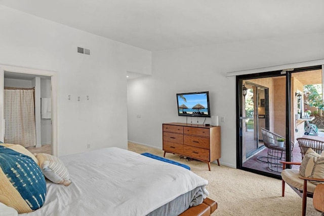 carpeted bedroom featuring access to outside