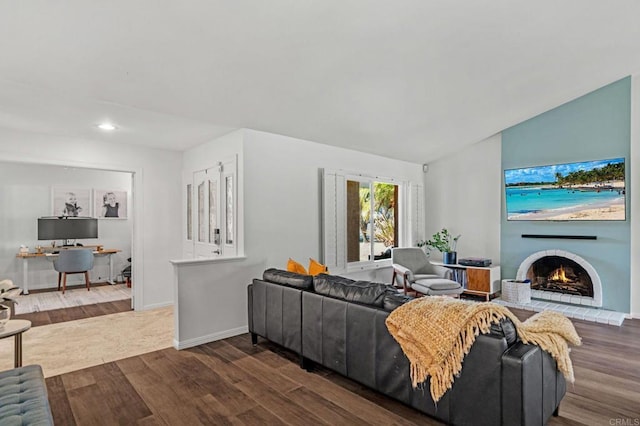 living room with lofted ceiling and dark wood-type flooring