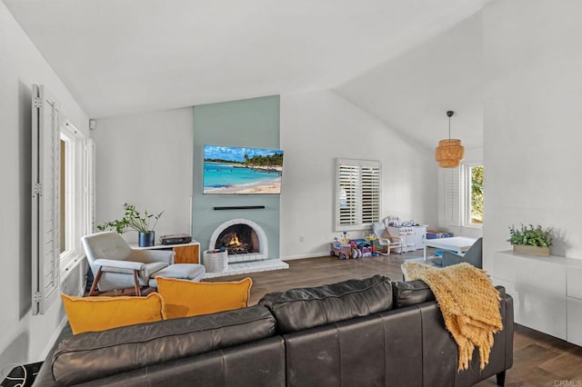 living room featuring lofted ceiling and dark hardwood / wood-style floors