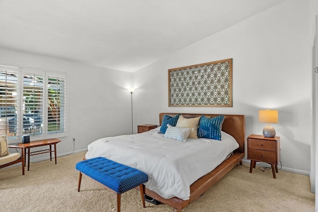 carpeted bedroom with vaulted ceiling