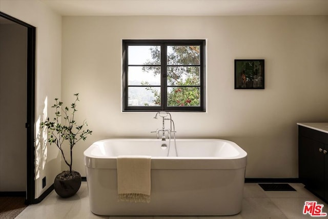 bathroom with a bath and vanity