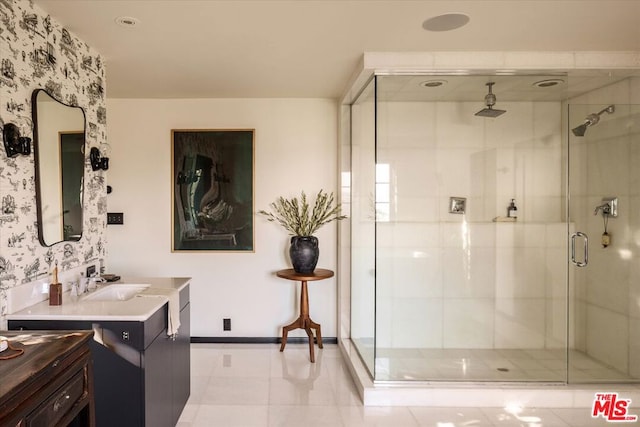 bathroom with vanity, tile patterned flooring, and an enclosed shower