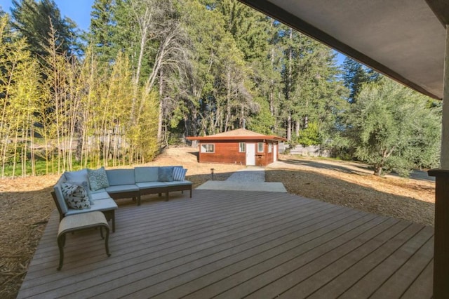 wooden deck with an outbuilding and outdoor lounge area