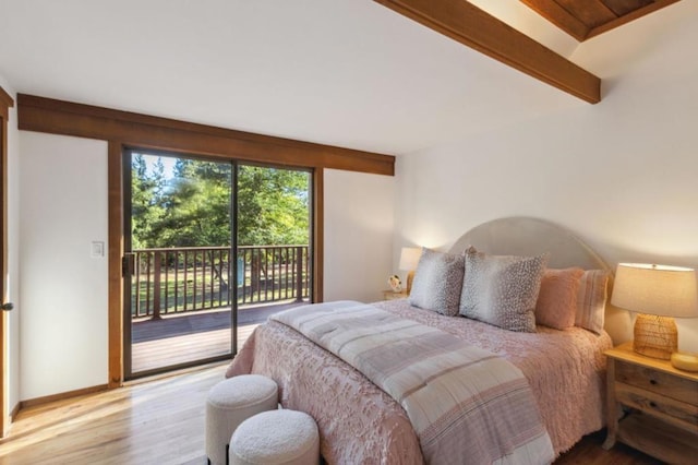 bedroom featuring access to outside, lofted ceiling with beams, and hardwood / wood-style flooring