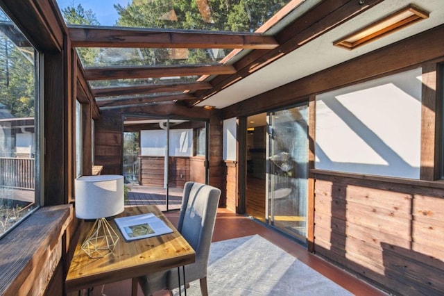 interior space featuring lofted ceiling with beams