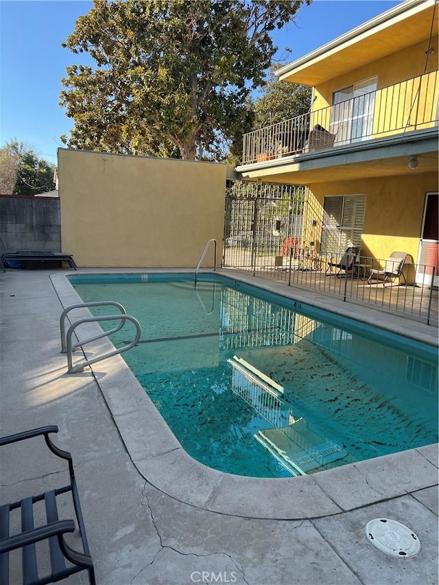 view of pool featuring a patio