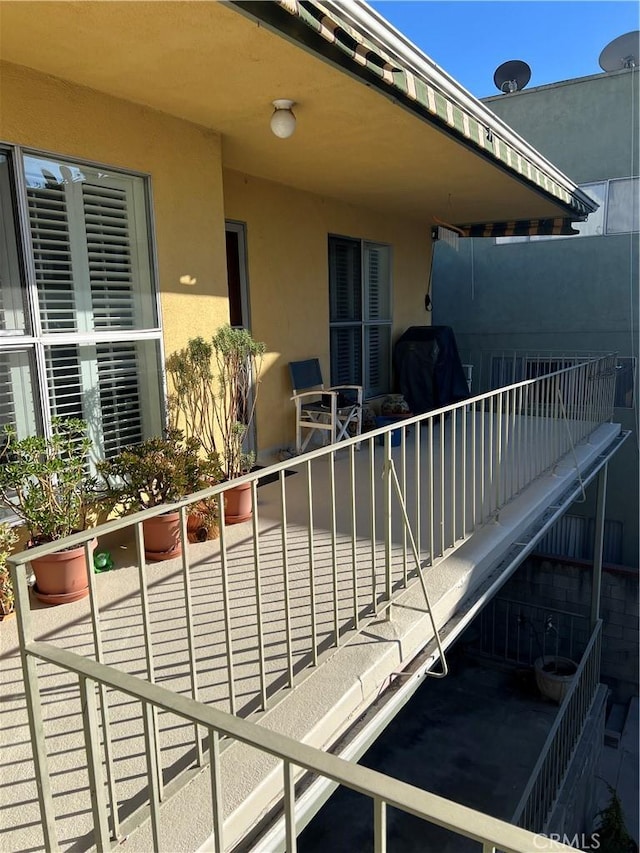 exterior space featuring grilling area and a balcony