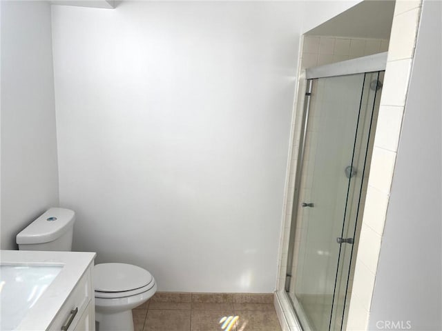 full bathroom with tile patterned floors, toilet, a stall shower, and vanity