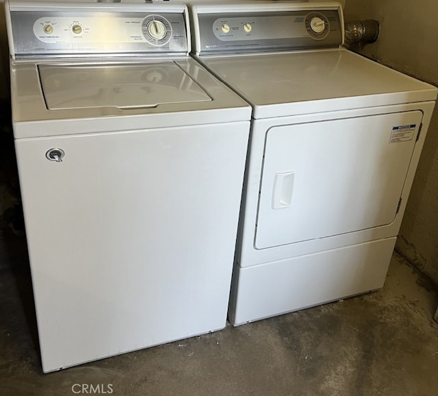 laundry room featuring washing machine and clothes dryer and laundry area