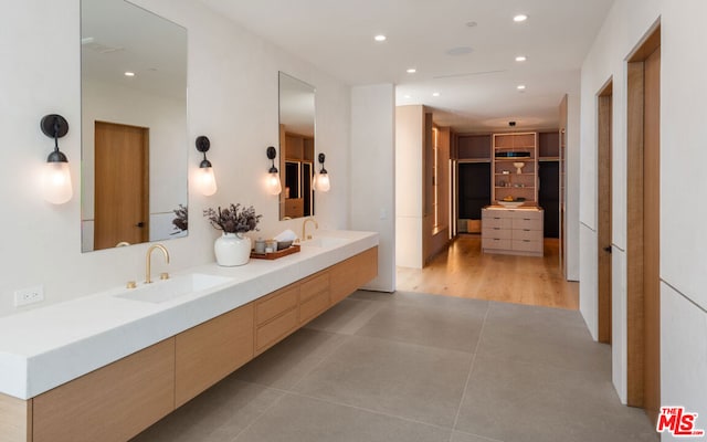 bathroom with tile patterned floors and vanity