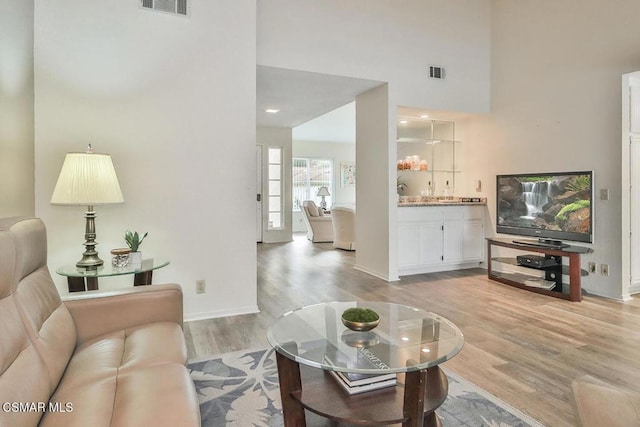 living room with light hardwood / wood-style flooring