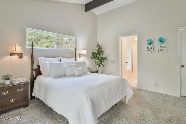 bedroom featuring high vaulted ceiling, connected bathroom, light carpet, and beam ceiling